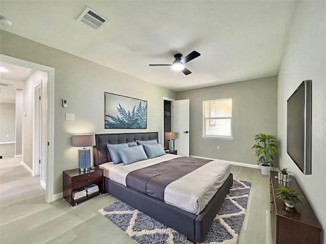 5039 Briscoe St, Houston, TX 77033 - bedroom with light wood-style floors, ceiling fan, and attic access