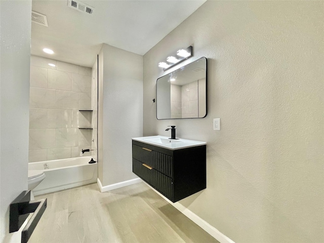 5039 Briscoe St, Houston, TX 77033 - bathroom featuring wood finished floors and vanity