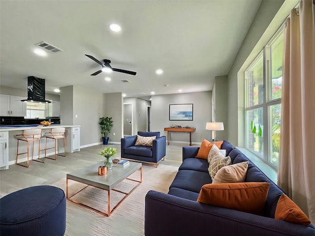 5039 Briscoe St, Houston, TX 77033 - living room with light wood finished floors, recessed lighting, and a ceiling fan