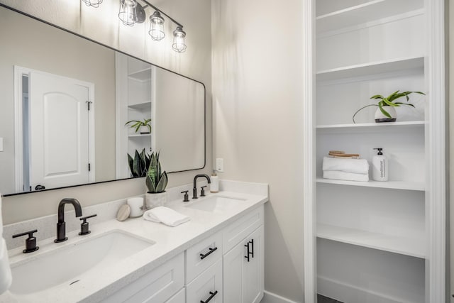 4101 E Rogers St, Houston, TX 77022 - bathroom featuring double vanity and built in shelves