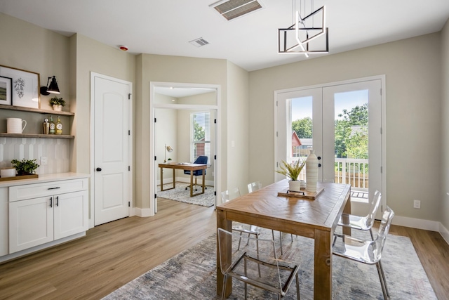 4101 E Rogers St, Houston, TX 77022 - dining area featuring french doors and light wood-style floors