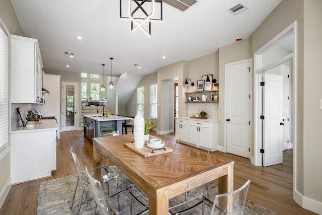 4101 E Rogers St, Houston, TX 77022 - dining room with wood finished floors and recessed lighting