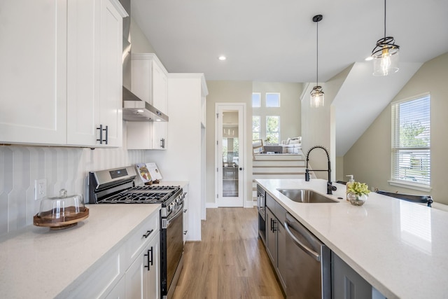4101 E Rogers St, Houston, TX 77022 - kitchen featuring appliances with stainless steel finishes, plenty of natural light, light countertops, and recessed lighting
