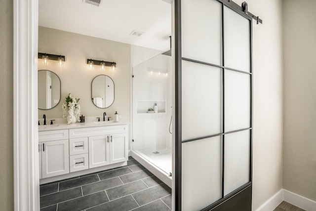 4101 E Rogers St, Houston, TX 77022 - bathroom featuring double vanity, a stall shower, and tile patterned floors