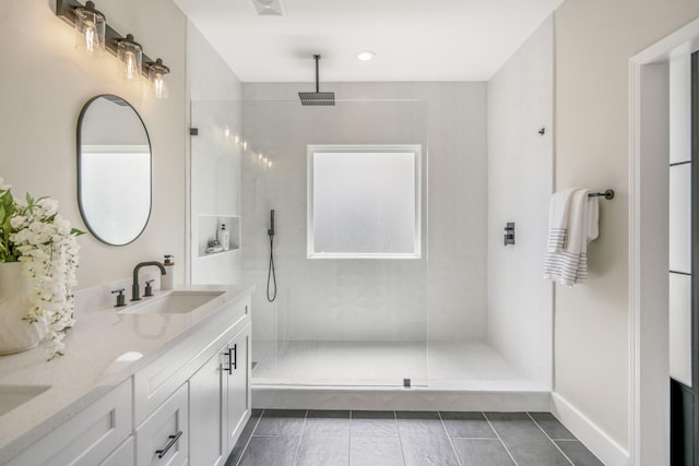 4101 E Rogers St, Houston, TX 77022 - full bath featuring double vanity, walk in shower, and tile patterned floors