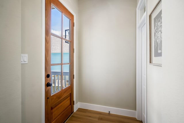 4101 E Rogers St, Houston, TX 77022 - doorway featuring dark wood-style floors and baseboards