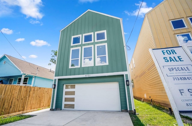 4101 E Rogers St, Houston, TX 77022 - contemporary home with board and batten siding, driveway, and a garage