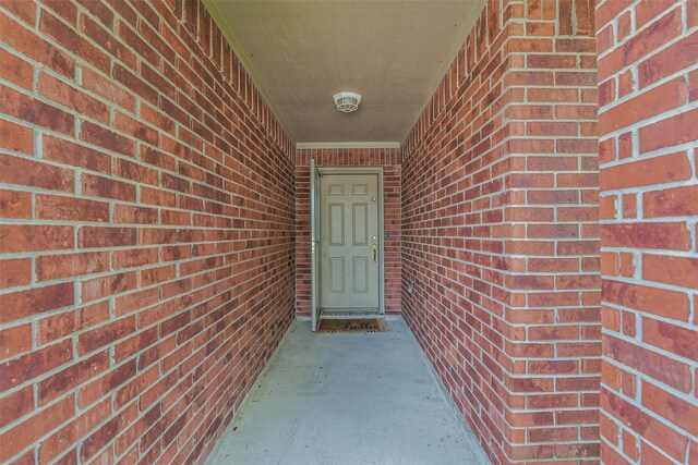 9214 Stingray Ct, Texas City, TX 77591 - doorway to property with brick siding