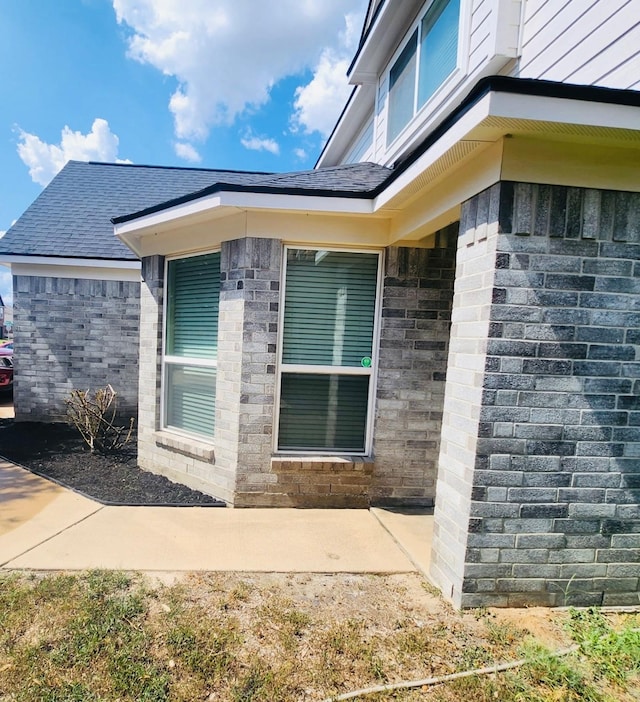 3154 Thicket Path Way, Katy, TX 77493 - view of home's exterior featuring roof with shingles and brick siding