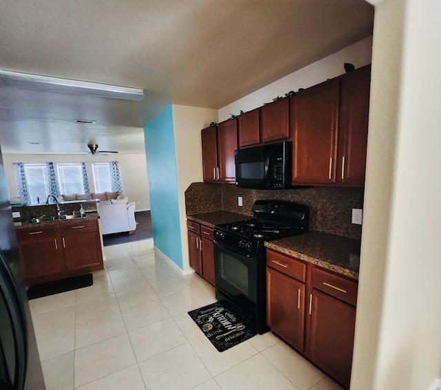 3154 Thicket Path Way, Katy, TX 77493 - kitchen with black appliances, decorative backsplash, open floor plan, light tile patterned flooring, and ceiling fan
