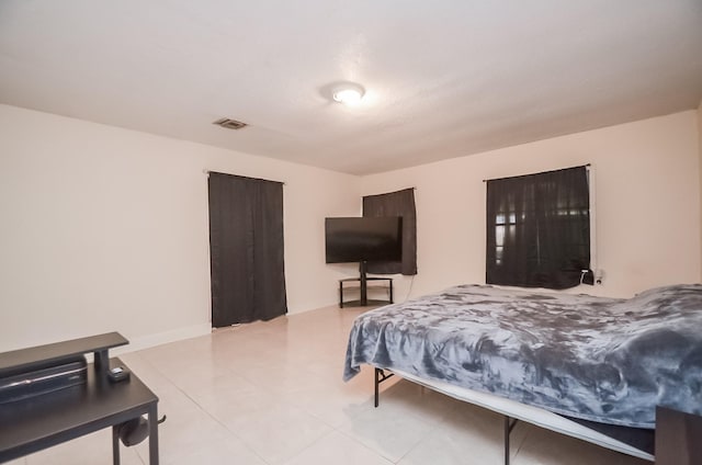 12806 Bauman Rd, North Houston, TX 77037 - bedroom featuring light tile patterned floors
