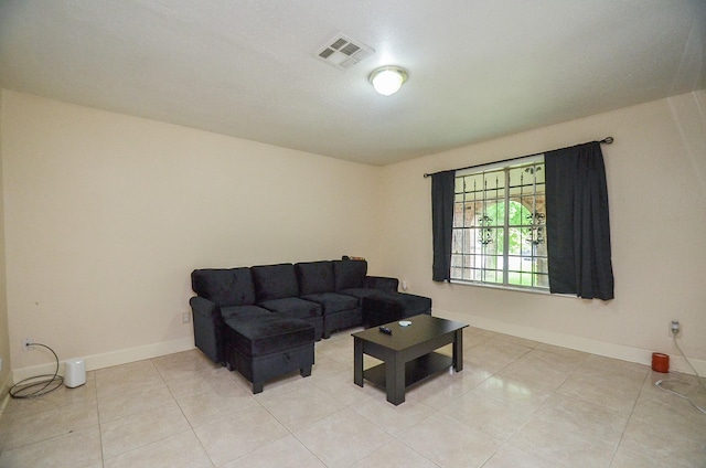 12806 Bauman Rd, North Houston, TX 77037 - living room featuring light tile patterned floors