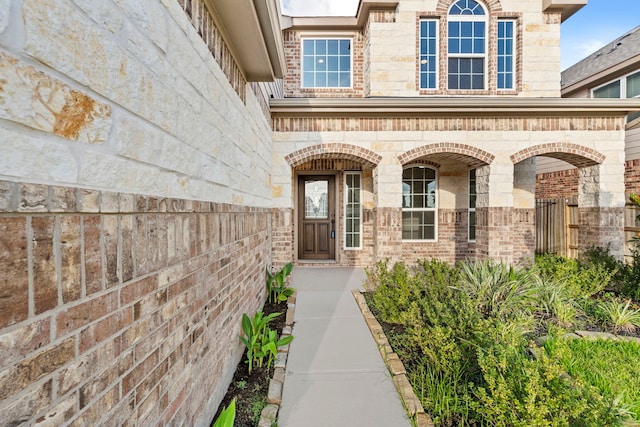 3506 Lake Bella Megan Dr, Katy, TX 77493 - property entrance with a porch, stone siding, and brick siding