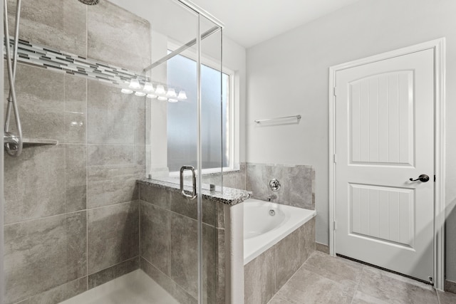 3506 Lake Bella Megan Dr, Katy, TX 77493 - bathroom with a shower stall, a garden tub, and tile patterned flooring