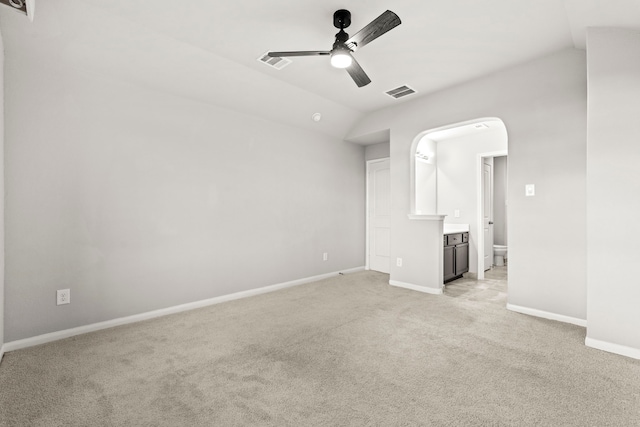 3506 Lake Bella Megan Dr, Katy, TX 77493 - spare room with a ceiling fan, light carpet, lofted ceiling, and arched walkways