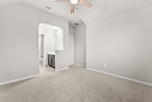 3506 Lake Bella Megan Dr, Katy, TX 77493 - spare room with ceiling fan, light carpet, vaulted ceiling, and arched walkways