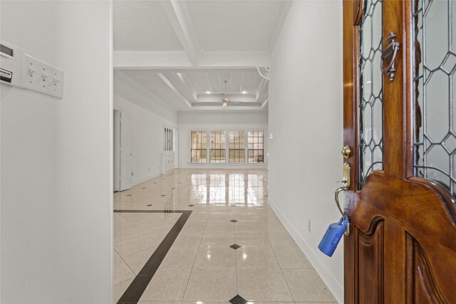 1015 Flagmore Dr, Katy, TX 77450 - entrance foyer with inlaid floor details, ornamental molding, tile patterned floors, and a tray ceiling