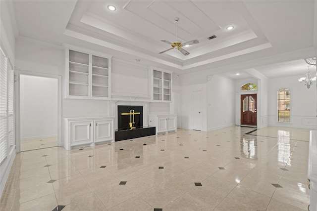 1015 Flagmore Dr, Katy, TX 77450 - unfurnished living room featuring a raised ceiling, ceiling fan, light tile patterned floors, and recessed lighting