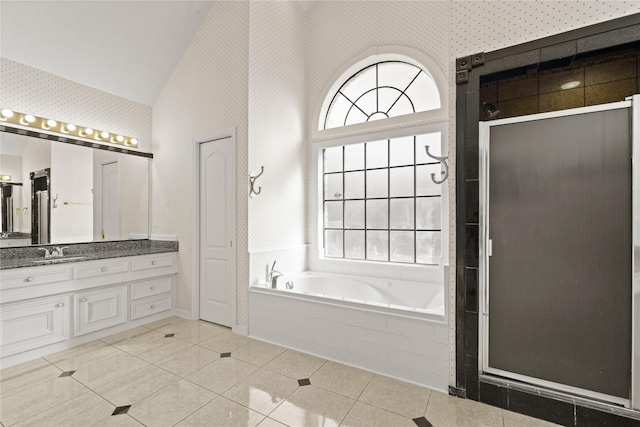 1015 Flagmore Dr, Katy, TX 77450 - full bath featuring high vaulted ceiling, vanity, a garden tub, a stall shower, and tile patterned flooring