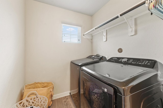 2231 Bright Sunrise Trl, Fresno, TX 77545 - laundry area with independent washer and dryer and wood finished floors