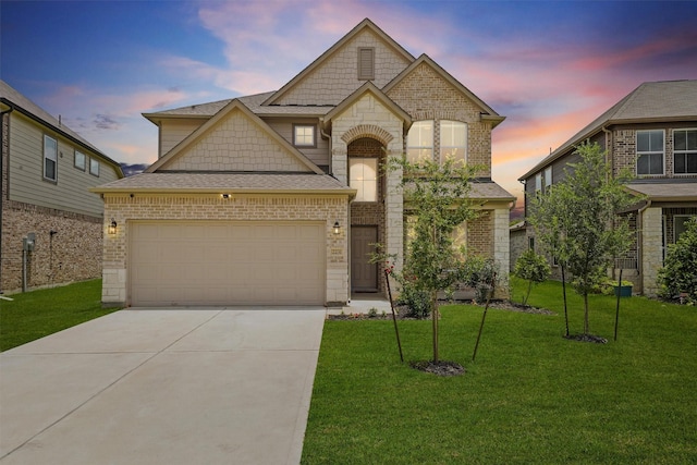 2231 Bright Sunrise Trl, Fresno, TX 77545 - french country inspired facade featuring concrete driveway, an attached garage, a lawn, stone siding, and a shingled roof