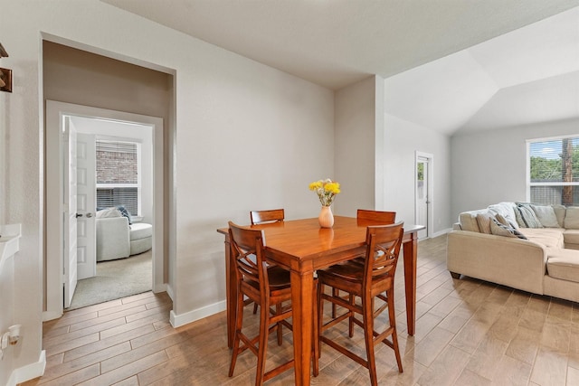 2231 Bright Sunrise Trl, Fresno, TX 77545 - dining area with light wood finished floors and vaulted ceiling