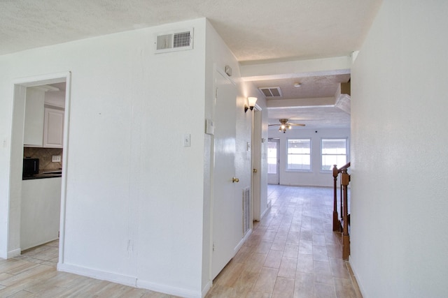 11667 Sabo Rd, Houston, TX 77089 - hall with light wood-style floors and baseboards