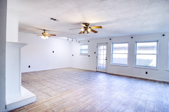 11667 Sabo Rd, Houston, TX 77089 - unfurnished living room featuring ceiling fan, wood finished floors, and a textured ceiling