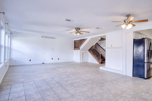 11667 Sabo Rd, Houston, TX 77089 - unfurnished living room featuring ceiling fan, stairway, and light tile patterned floors