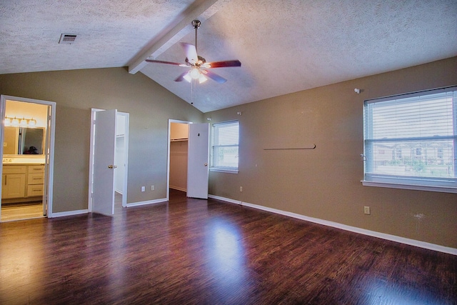 11667 Sabo Rd, Houston, TX 77089 - unfurnished bedroom with wood finished floors, a textured ceiling, a walk in closet, ensuite bathroom, and ceiling fan