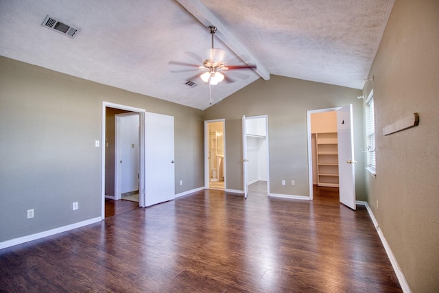 11667 Sabo Rd, Houston, TX 77089 - unfurnished bedroom with wood finished floors, a walk in closet, a ceiling fan, and a textured ceiling