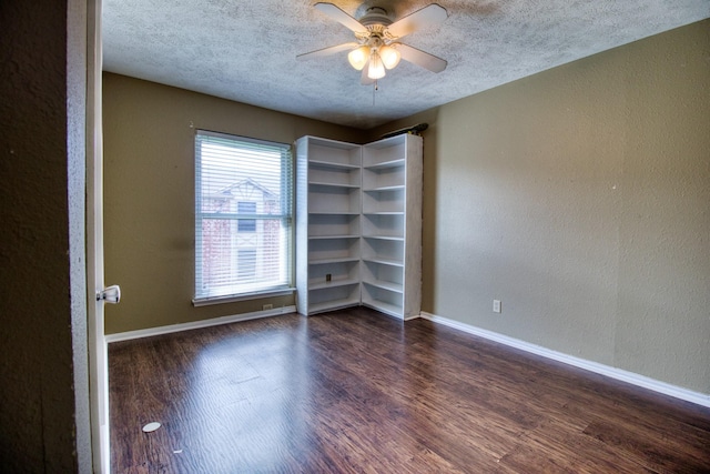 11667 Sabo Rd, Houston, TX 77089 - spare room featuring dark wood-style floors, a textured ceiling, ceiling fan, and a textured wall