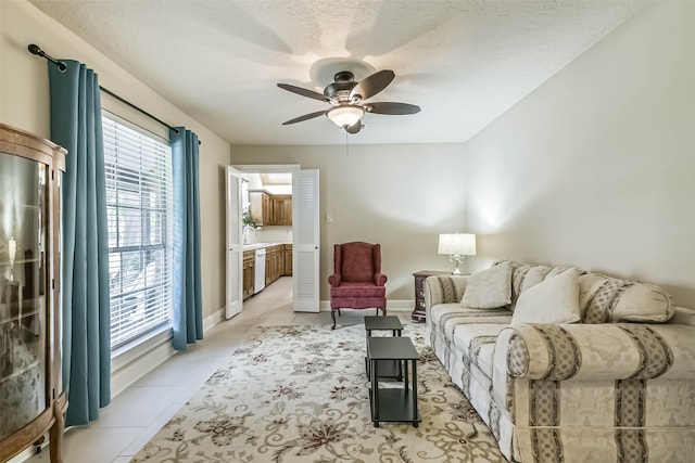 3914 Cherry Forest Dr, Houston, TX 77088 - living room featuring plenty of natural light, ceiling fan, and light tile patterned flooring