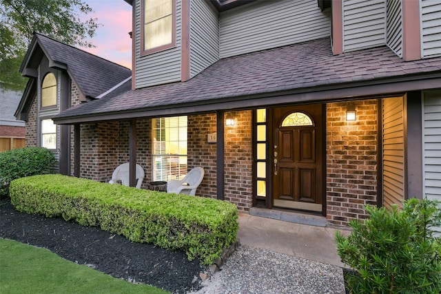 3914 Cherry Forest Dr, Houston, TX 77088 - entrance to property with brick siding, roof with shingles, and covered porch