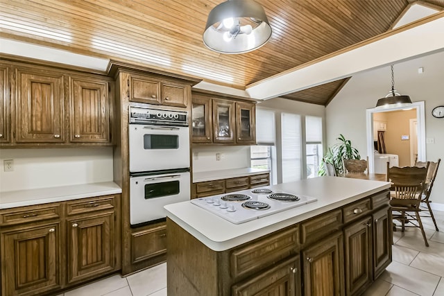3914 Cherry Forest Dr, Houston, TX 77088 - kitchen featuring white appliances, wood ceiling, lofted ceiling, light tile patterned flooring, and light countertops