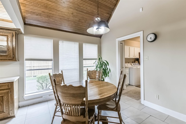 3914 Cherry Forest Dr, Houston, TX 77088 - dining room with washing machine and clothes dryer, wood ceiling, light tile patterned flooring, and lofted ceiling