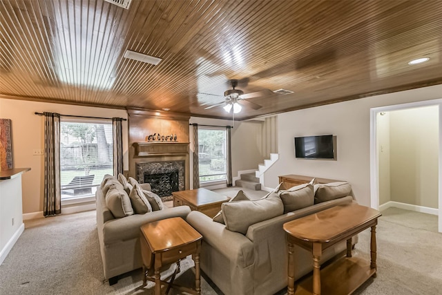 3914 Cherry Forest Dr, Houston, TX 77088 - living room with wood ceiling, light carpet, a ceiling fan, a premium fireplace, and stairway