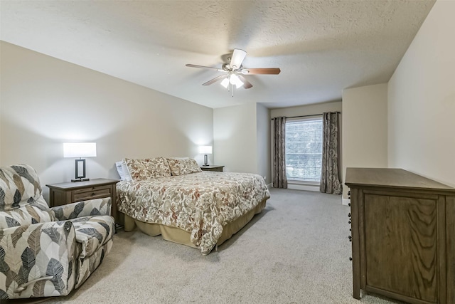 3914 Cherry Forest Dr, Houston, TX 77088 - bedroom with light carpet, a ceiling fan, and a textured ceiling
