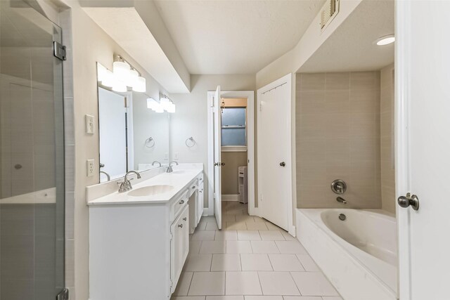 3914 Cherry Forest Dr, Houston, TX 77088 - bathroom with double vanity, a bath, tile patterned flooring, and a shower with door