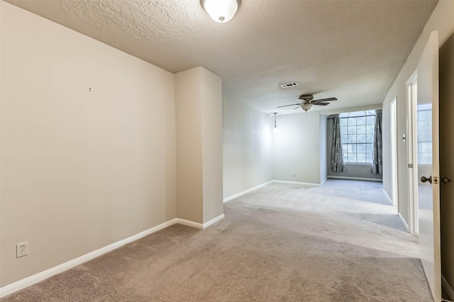 3914 Cherry Forest Dr, Houston, TX 77088 - empty room featuring a ceiling fan, a textured ceiling, and light carpet