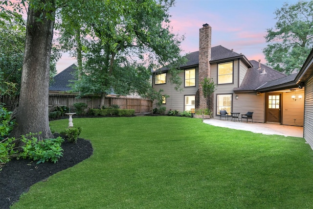 3914 Cherry Forest Dr, Houston, TX 77088 - back of property with a patio area, a chimney, and a shingled roof
