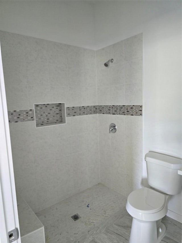 14387 Half Circle St, Splendora, TX 77372 - full bathroom with toilet and tiled shower