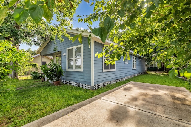 8215 Canyon St, Houston, TX 77051 - view of side of property with a yard and a patio