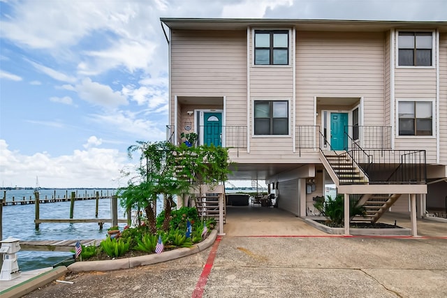 3663 Nasa Pkwy Unit 301, Seabrook, TX 77586 - view of front facade with stairs and a water view