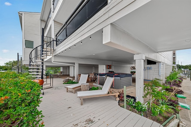 3663 Nasa Pkwy Unit 301, Seabrook, TX 77586 - wooden terrace featuring a hot tub and stairway