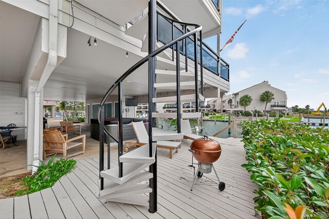 3663 Nasa Pkwy Unit 301, Seabrook, TX 77586 - deck with a water view, a dock, and stairs