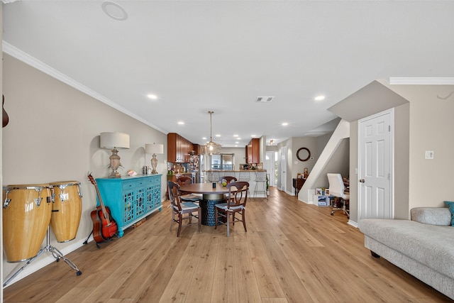 3663 Nasa Pkwy Unit 301, Seabrook, TX 77586 - dining space featuring crown molding, light wood-style floors, and recessed lighting