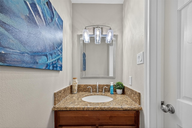 3663 Nasa Pkwy Unit 301, Seabrook, TX 77586 - bathroom featuring vanity and a textured wall
