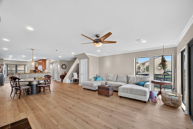 3663 Nasa Pkwy Unit 301, Seabrook, TX 77586 - living room featuring light wood finished floors, ornamental molding, recessed lighting, and a ceiling fan
