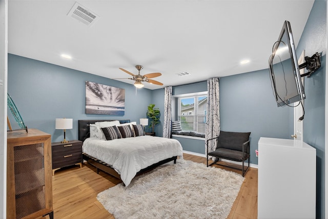 3663 Nasa Pkwy Unit 301, Seabrook, TX 77586 - bedroom with light wood-type flooring, a ceiling fan, and recessed lighting